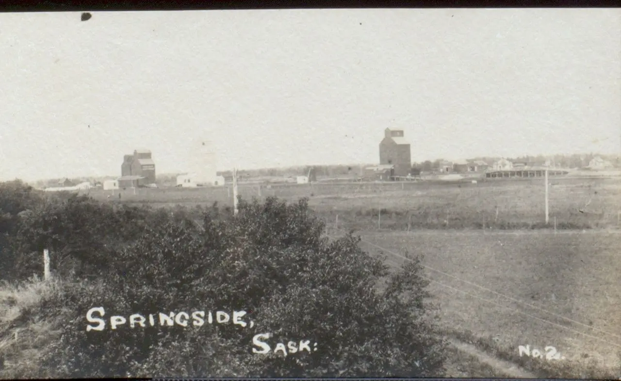View of Springside with grain elevators, about 1912